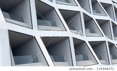 Modern building facade featuring geometric architectural pattern and balconies 134946472