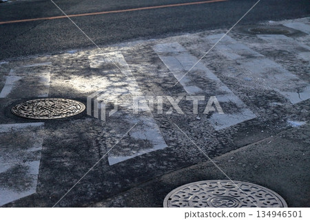 Frozen road surface Frozen road surface 134946501