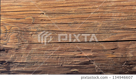 Weathered wood texture showing brown timber surface grain 134946607