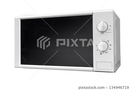 White microwave oven preparing food in kitchen 134946719