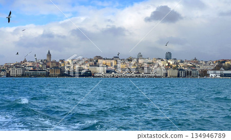 Istanbul cityscape with galata tower along bosphorus on cloudy day Istanbul cityscape with galata tower along bosphorus on cloudy day 134946789