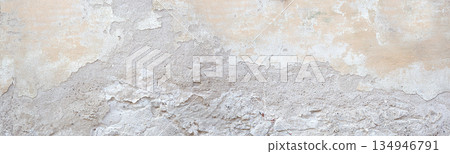 Peeling plaster creating an old weathered wall texture 134946791