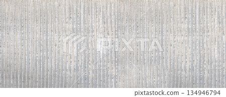 Concrete wall featuring rough vertical striped texture Concrete wall featuring rough vertical striped texture 134946794