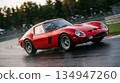 A red sports car running on a circuit 134947260