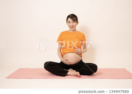 A woman doing maternity yoga 134947980
