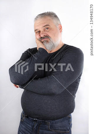 Portrait of a bearded middle-aged man with gray hair Portrait of a bearded middle-aged man with gray hair 134948170