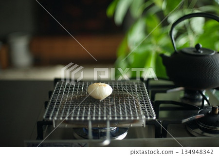 Grilling rice cakes on a grill Grilling rice cakes on a grill 134948342