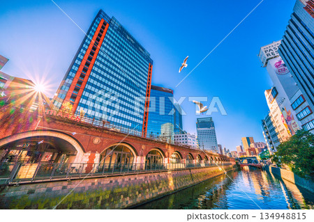 A ray of hope for the Tokyo cityscape in Japan...View of Marche Écute Kanda Manseibashi, Kanda River, and the direction of Ochanomizu Station from Manseibashi Bridge 134948815