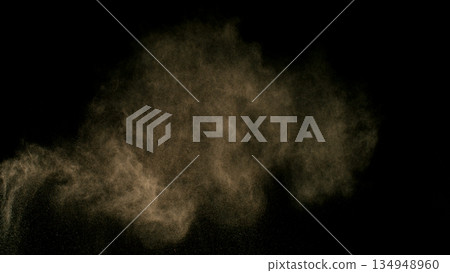 Freeze Motion Shot of Flying Sand Dust , Isolated on Black Background Freeze Motion Shot of Flying Sand Dust , Isolated on Black Background 134948960