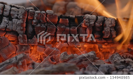 Close-up of Hot Embers with Flying Sparks . Concept of heating Fireplace Close-up of Hot Embers with Flying Sparks . Concept of heating Fireplace 134948985
