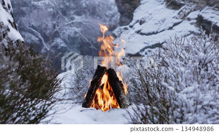 Crackling Campfire in the Winter Foggy Rocky Mountains , Harsh Atmosphere , Authentic Place Crackling Campfire in the Winter Foggy Rocky Mountains , Harsh Atmosphere , Authentic Place 134948986