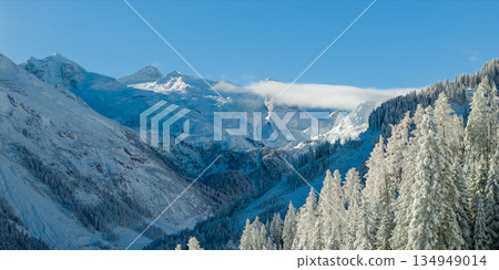 Panorama view of a snow-covered high mountains in Austria Alps Panorama view of a snow-covered high mountains in Austria Alps 134949014