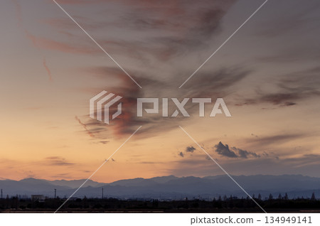 A winter sunset over the Chichibu Mountains and clouds floating across the sky A winter sunset over the Chichibu Mountains and clouds floating across the sky 134949141