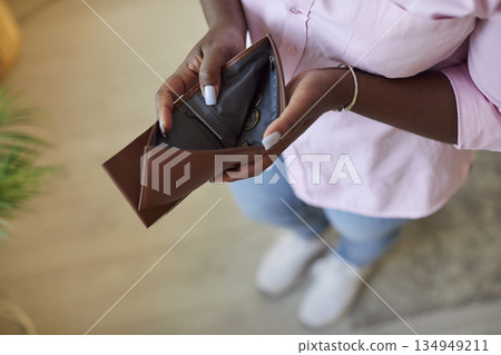 Unrecognizable African American woman with empty wallet, close up 134949211