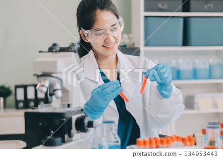 Portrait, science and happy woman on laptop in lab to research chemistry, test or innovation. Microscope, scientist and face of medical doctor in goggles for microbiology, healthcare or pharma study Portrait, science and happy woman on laptop in lab to research chemistry, test or innovation. Microscope, scientist and face of medical doctor in goggles for microbiology, healthcare or pharma study 134953441