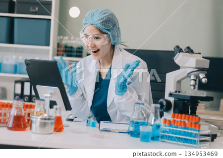 Portrait, science and happy woman on laptop in lab to research chemistry, test or innovation. Microscope, scientist and face of medical doctor in goggles for microbiology, healthcare or pharma study Portrait, science and happy woman on laptop in lab to research chemistry, test or innovation. Microscope, scientist and face of medical doctor in goggles for microbiology, healthcare or pharma study 134953469