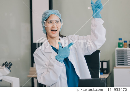 Portrait, science and happy woman on laptop in lab to research chemistry, test or innovation. Microscope, scientist and face of medical doctor in goggles for microbiology, healthcare or pharma study Portrait, science and happy woman on laptop in lab to research chemistry, test or innovation. Microscope, scientist and face of medical doctor in goggles for microbiology, healthcare or pharma study 134953470