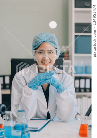 Portrait, science and happy woman on laptop in lab to research chemistry, test or innovation. Microscope, scientist and face of medical doctor in goggles for microbiology, healthcare or pharma study Portrait, science and happy woman on laptop in lab to research chemistry, test or innovation. Microscope, scientist and face of medical doctor in goggles for microbiology, healthcare or pharma study 134953474