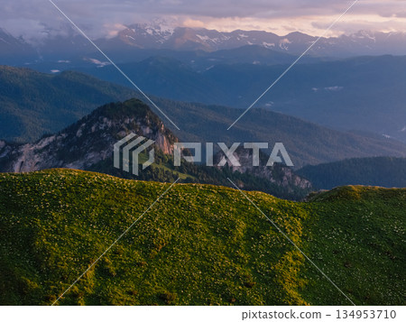 Mountains with dolomite rocks at sunrise with soft sunset light. Mountains with dolomite rocks at sunrise with soft sunset light. 134953710