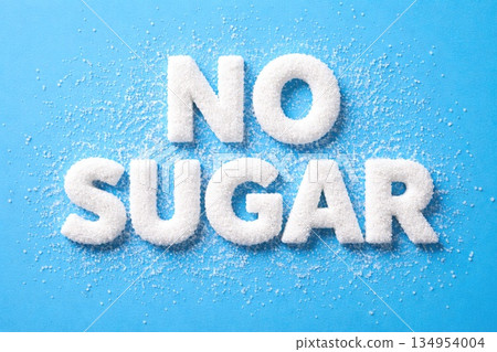 No Sugar Concept Text Made from White Sugar Crystals on Blue Background No Sugar Concept Text Made from White Sugar Crystals on Blue Background 134954004