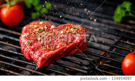 Raw Beef Steak Seasoned with Herbs on Hot Grill Close-Up Raw Beef Steak Seasoned with Herbs on Hot Grill Close-Up 134954097