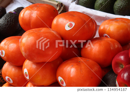ripe Persimmon stock on shop for sell ripe Persimmon stock on shop for sell 134954187