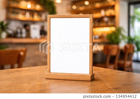Blank Wooden Frame Menu Mockup on Table in Cozy Cafe Interior 134954412