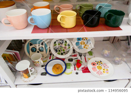 Colorful multipurpose crockery cups and modern plates Colorful multipurpose crockery cups and modern plates 134956095
