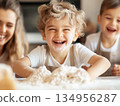 Happy children baking in the 134956287