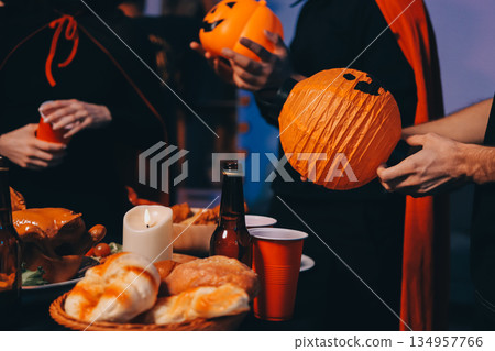 Friends enjoying a Halloween party at a bar making a toast Friends enjoying a Halloween party at a bar making a toast 134957766