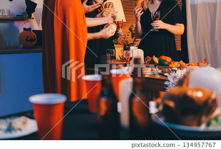 Friends enjoying a Halloween party at a bar making a toast Friends enjoying a Halloween party at a bar making a toast 134957767