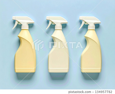 Brand friendly. Yellow sprays in a row. Disinfectant, glass cleaner, all-purpose surface cleaner. Mockup for branding cleaning product. 134957782