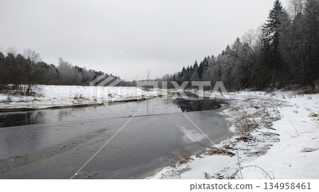 A river with snow on the ground 134958461