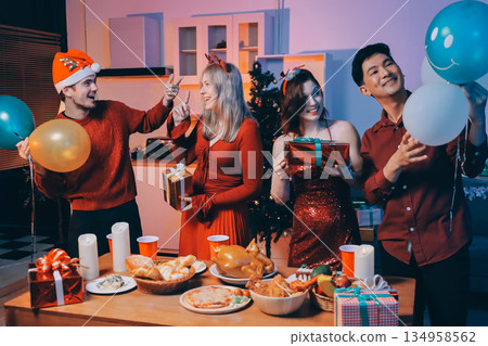 Festive Office Christmas Party with Delicious Food. A beautifully decorated office space with Christmas trees and festive lights, set up for a holiday party. Festive Office Christmas Party with Delicious Food. A beautifully decorated office space with Christmas trees and festive lights, set up for a holiday party. 134958562