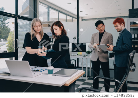 Multiracial business people having meeting Multiracial business people having meeting 134958582