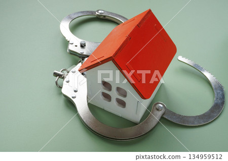 House locked in handcuffs. Property seizure and legal restrictions. 134959512