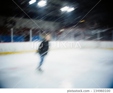 A person practices figure skating on an ice rink during the Christmas season. The scene is lively with bright lights and a blurred background of spectators Generative AI 134960100