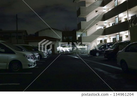 Apartment car park and bicycle parking area at night Apartment car park and bicycle parking area at night 134961204