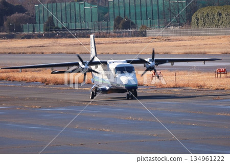 A small propeller-driven passenger plane exudes tension before takeoff A small propeller-driven passenger plane exudes tension before takeoff 134961222