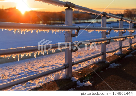 Icicles on the handrail early in the morning Icicles on the handrail early in the morning 134961444