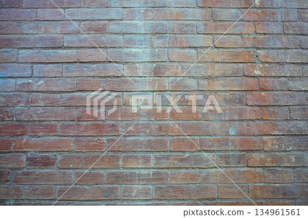 Wide red brick wall with uneven color and grunge texture 134961561