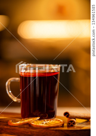 Warm glass of mulled wine with spices 134961585