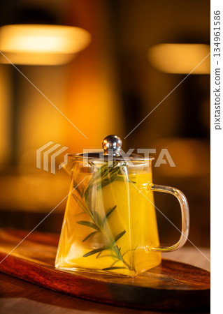 Glass teapot with herbal tea infusion Glass teapot with herbal tea infusion 134961586