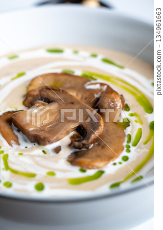 Creamy mushroom soup with garnish 134961663
