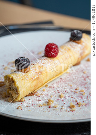 Gourmet rolled pancake with berries Gourmet rolled pancake with berries 134961812
