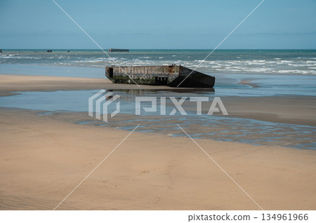 Visible remains of the Mulberry Harbour platforms on the beach of Arromanches-les-Bains, France. These massive concrete structures were used during the D-Day landings in World War II. Visible remains of the Mulberry Harbour platforms on the beach of Arromanches-les-Bains, France. These massive concrete structures were used during the D-Day landings in World War II. 134961966