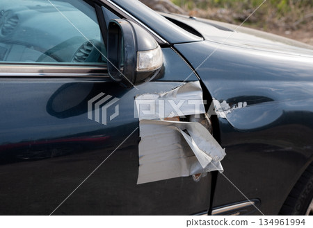 Close-up of taped broken side mirror on damaged blue vehicle Close-up of taped broken side mirror on damaged blue vehicle 134961994