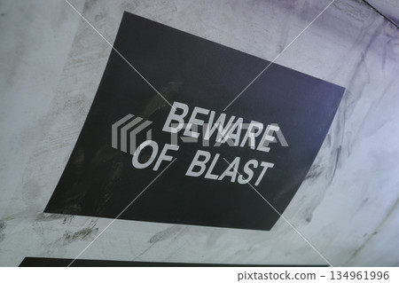 Warning sign beware of blast on aircraft fuselage surface 134961996