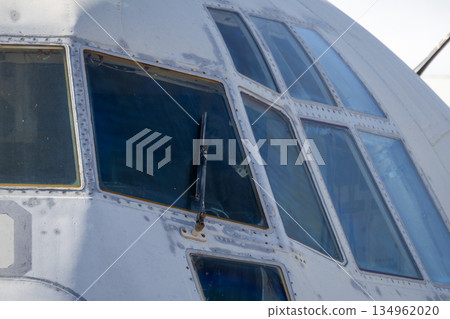 Detail of cockpit glazing and fuselage on decommissioned transport aircraft Detail of cockpit glazing and fuselage on decommissioned transport aircraft 134962020