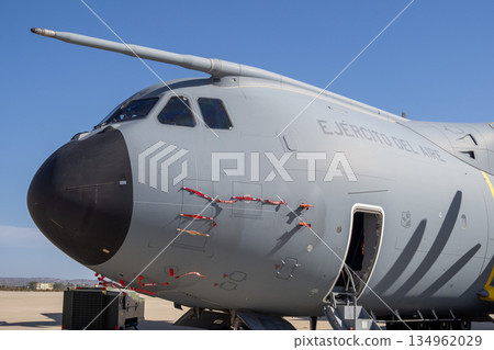 Military airlifter nose section with cockpit and refueling probe on apron 134962029